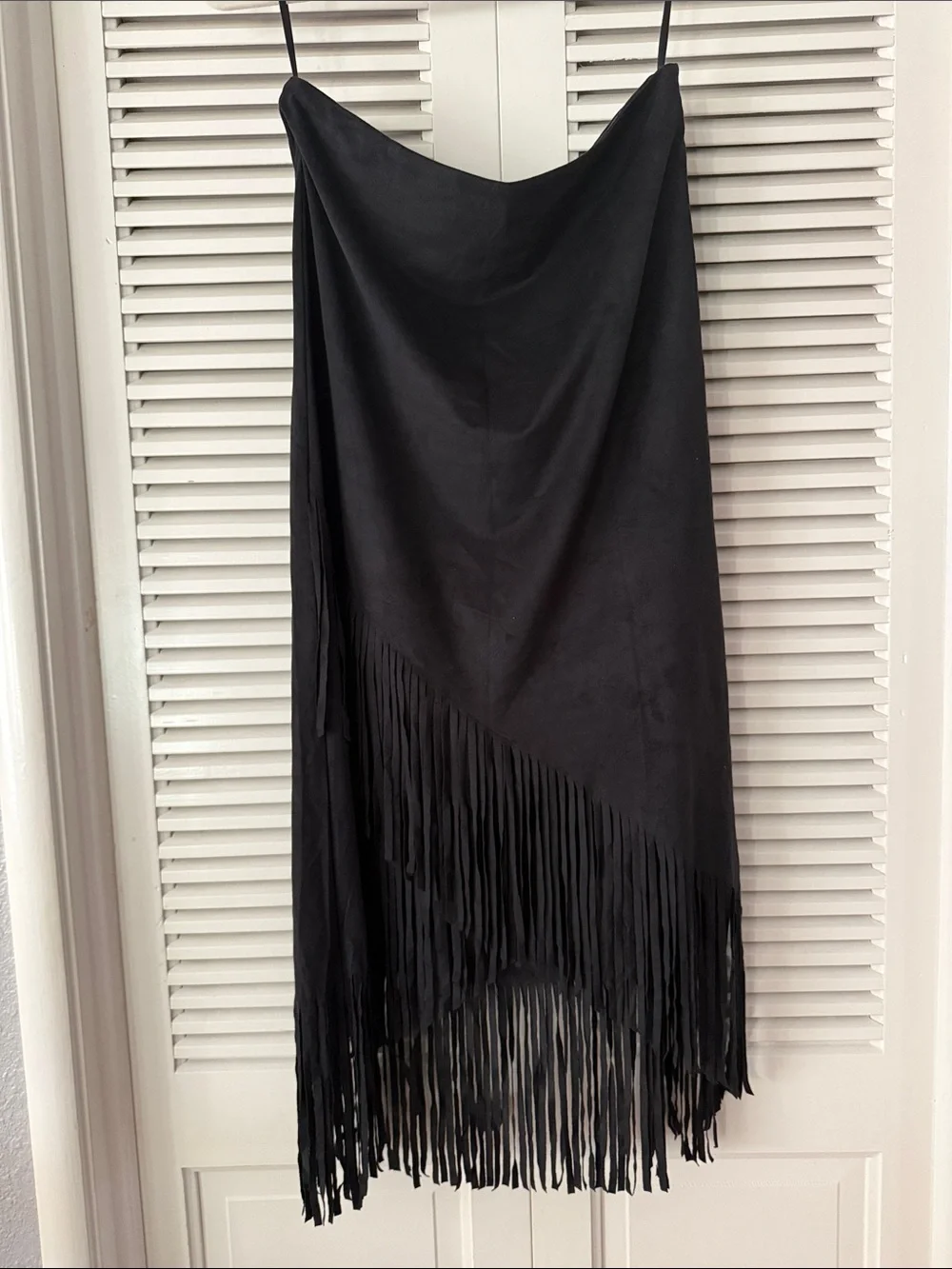 Sleek black skirt with long fringe hem. Soft suede-like texture. Hobo